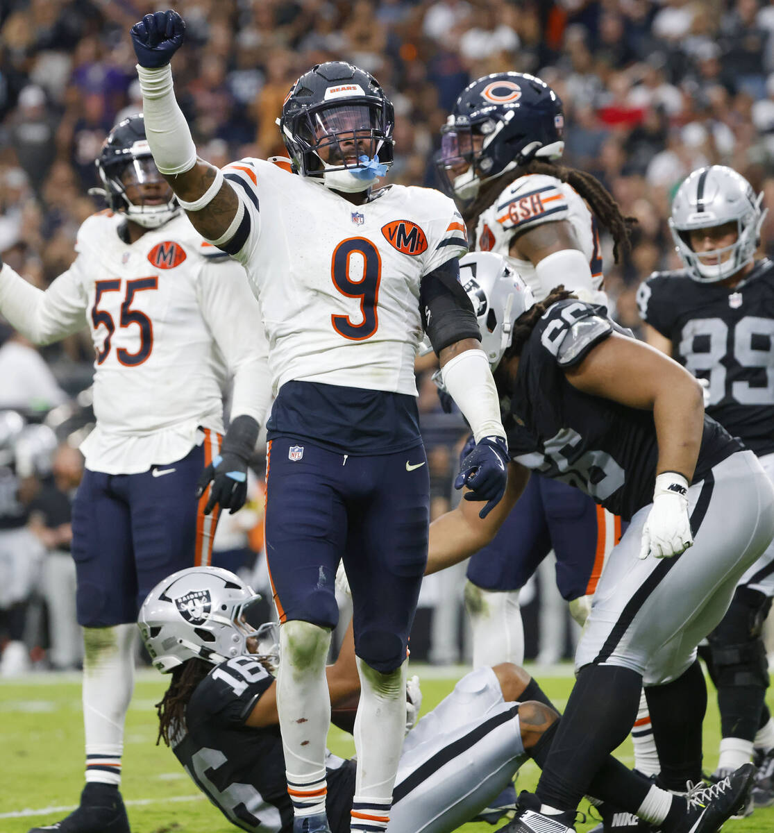 Chicago Bears safety Jaquan Brisker (9) reacts after tackling Raiders wide receiver Jakobi Meye ...