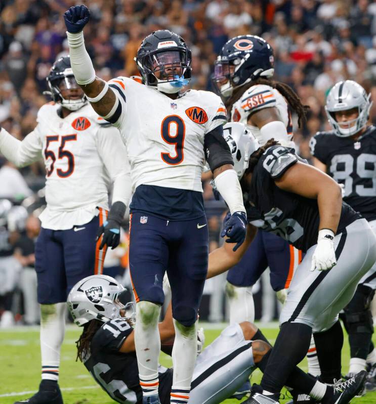 Chicago Bears safety Jaquan Brisker (9) reacts after tackling Raiders wide receiver Jakobi Meye ...