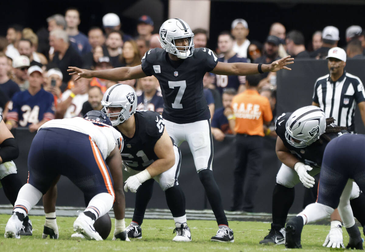 Raiders quarterback Geno Smith (7) signals during the second half an NFL football game against ...