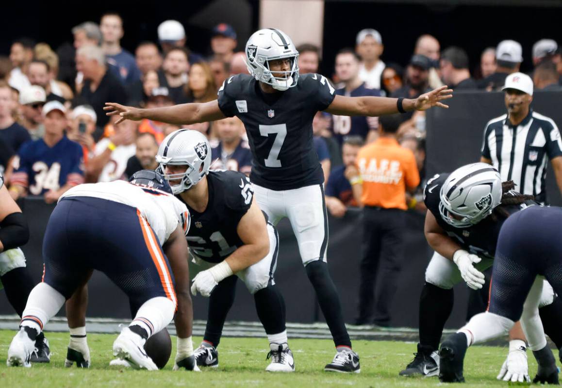 Raiders quarterback Geno Smith (7) signals during the second half an NFL football game against ...