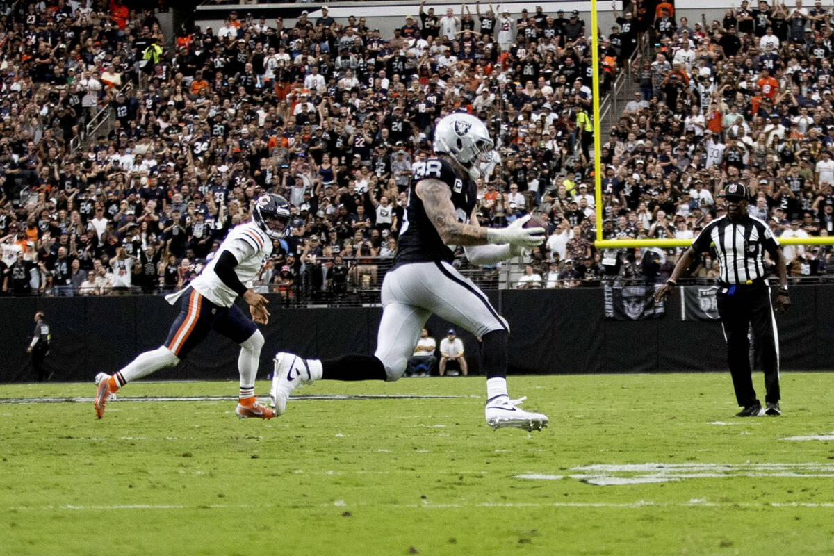 Raiders defensive end Maxx Crosby (98) intercepts a pass from Chicago Bears quarterback Caleb W ...
