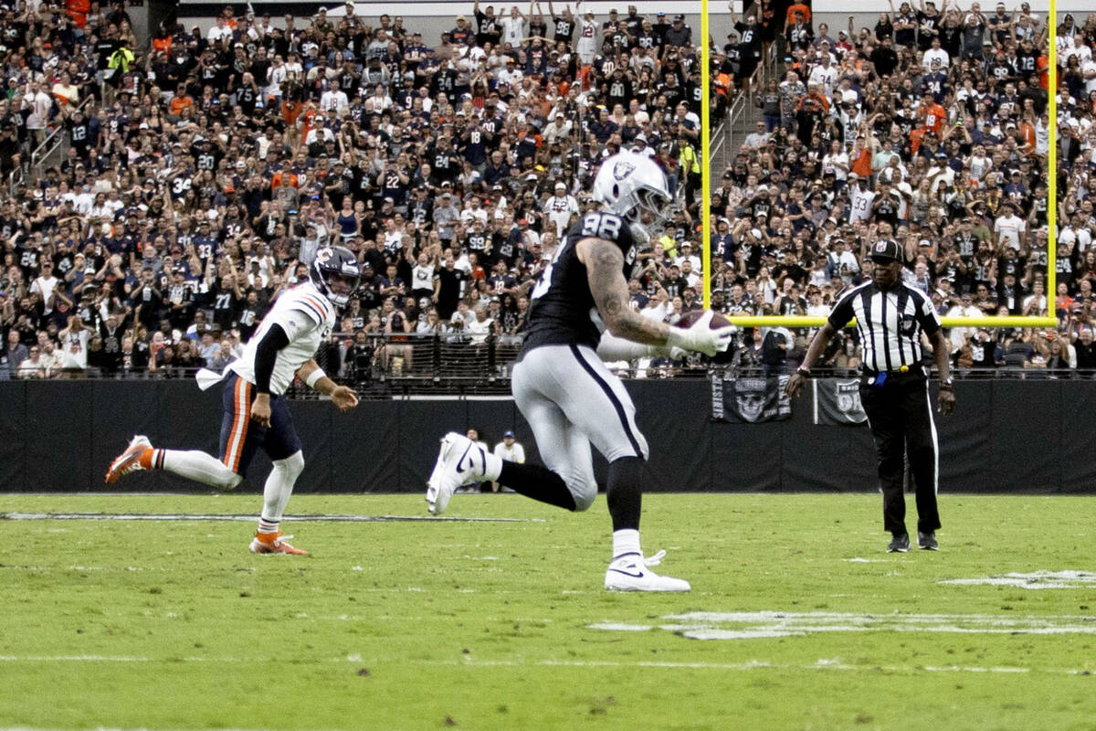 Raiders defensive end Maxx Crosby (98) intercepts a pass from Chicago Bears quarterback Caleb W ...