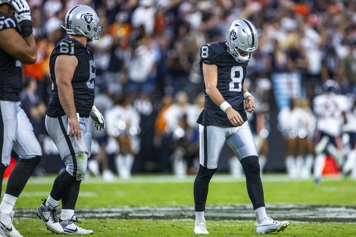 Raiders kicker Daniel Carlson (8) looks down after a deflection by Chicago Bears cornerback Jos ...