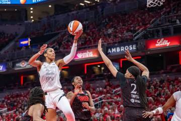 Las Vegas Aces center A'ja Wilson (22) shoots over Indiana Fever forward Makayla Timpson ( ...