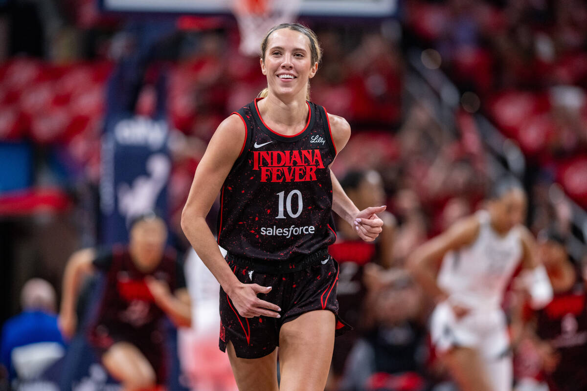 Indiana Fever guard Lexie Hull reacts after scoring during the first half of Game 4 of a WNBA b ...