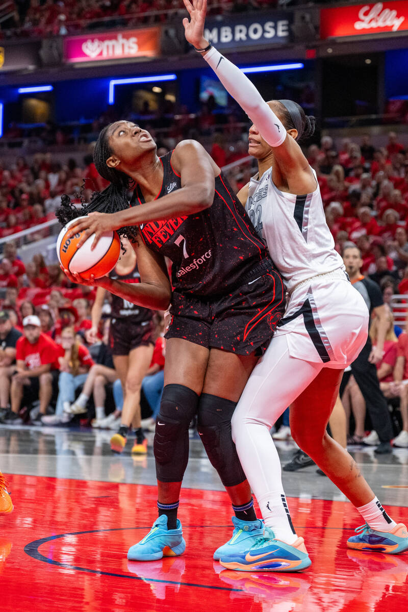 Indiana Fever forward Aliyah Boston (7) looks to shoot while defended by Las Vegas Aces center ...