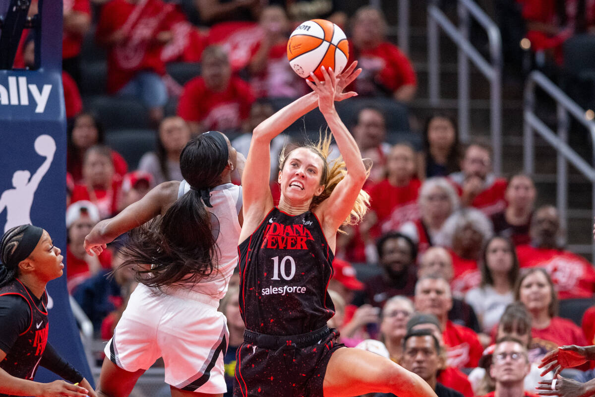 Indiana Fever guard Lexie Hull (10) reaches for a rebound during the second half of Game 4 of a ...