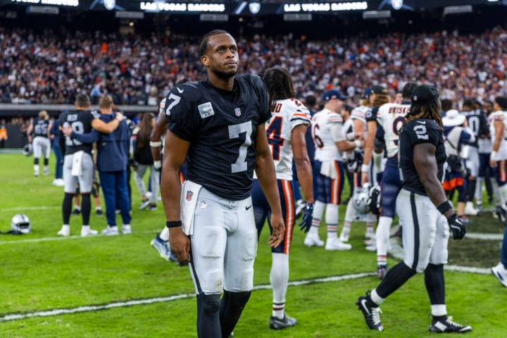 Raiders quarterback Geno Smith (7) unhappily walks off the field after a late loss to the Chica ...