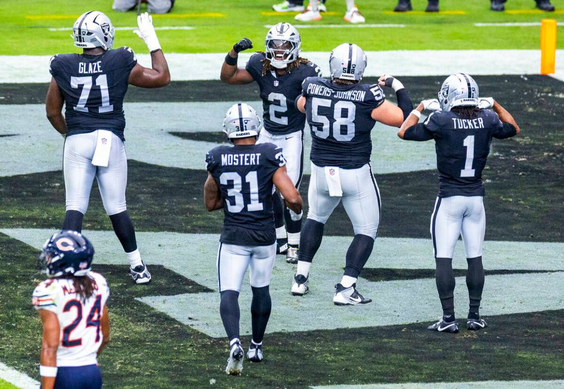 Raiders running back Ashton Jeanty (2) celebrates a touchdown with teammates against the Chicag ...