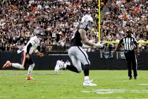 Raiders defensive end Maxx Crosby (98) intercepts a pass from Chicago Bears quarterback Caleb W ...