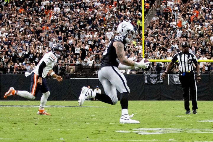 Raiders defensive end Maxx Crosby (98) intercepts a pass from Chicago Bears quarterback Caleb W ...