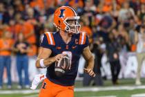 Illinois quarterback Luke Altmyer (9) looks to pass during the second half of an NCAA college f ...