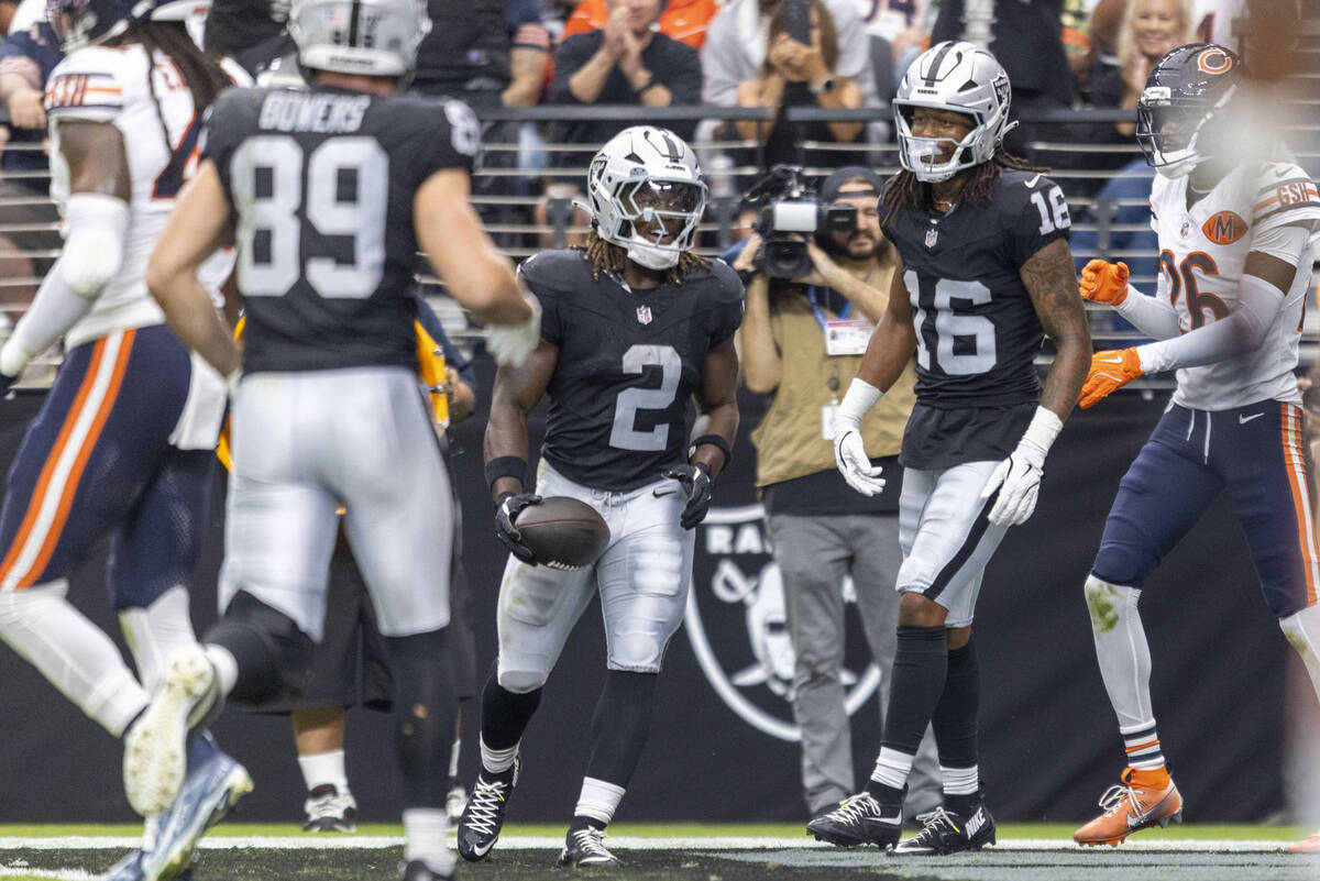 Raiders running back Ashton Jeanty (2) celebrates his touchdown with wide receiver Jakobi Meyer ...