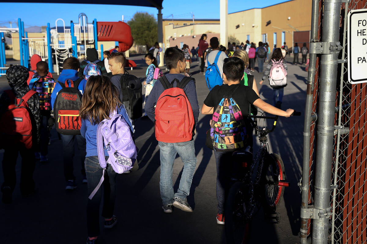 Students arrive at the start of the school day at Manch Elementary in Las Vegas Tuesday, Oct. 2 ...