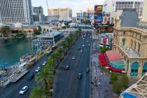 Workers install grandstands, left, in front of the Bellagio Fountains for the 2025 Formula One ...