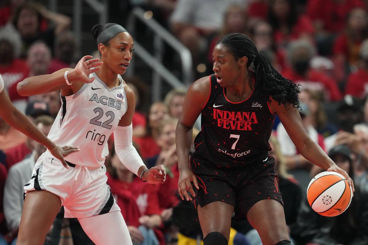 Indiana Fever's Aliyah Boston (7) is defended by Las Vegas Aces' A'ja Wilson (22 ...
