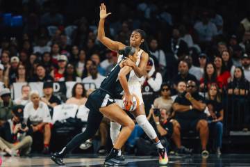 Indiana Fever forward Aliyah Boston (7) commits a foul against Aces center A'ja Wilson (22 ...