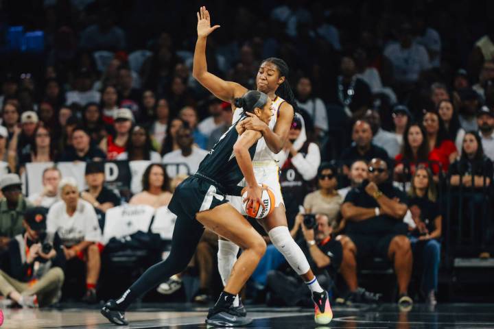 Indiana Fever forward Aliyah Boston (7) commits a foul against Aces center A'ja Wilson (22 ...