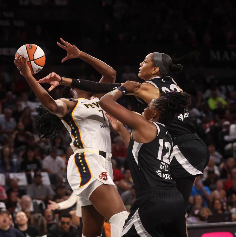 Indiana Fever forward Aliyah Boston (7) tries to hold onto a rebound against Aces center A&#039 ...
