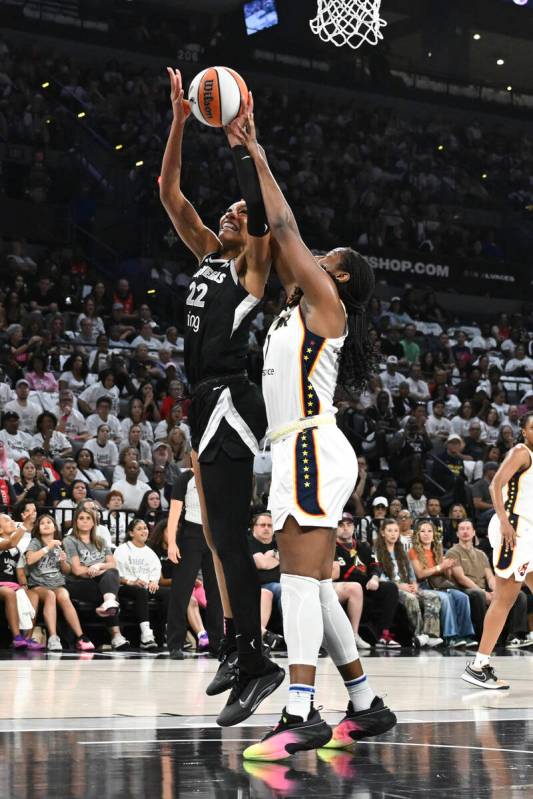 Las Vegas Aces center A'ja Wilson (22) shoots against Indiana Fever forward Aliyah Boston ...