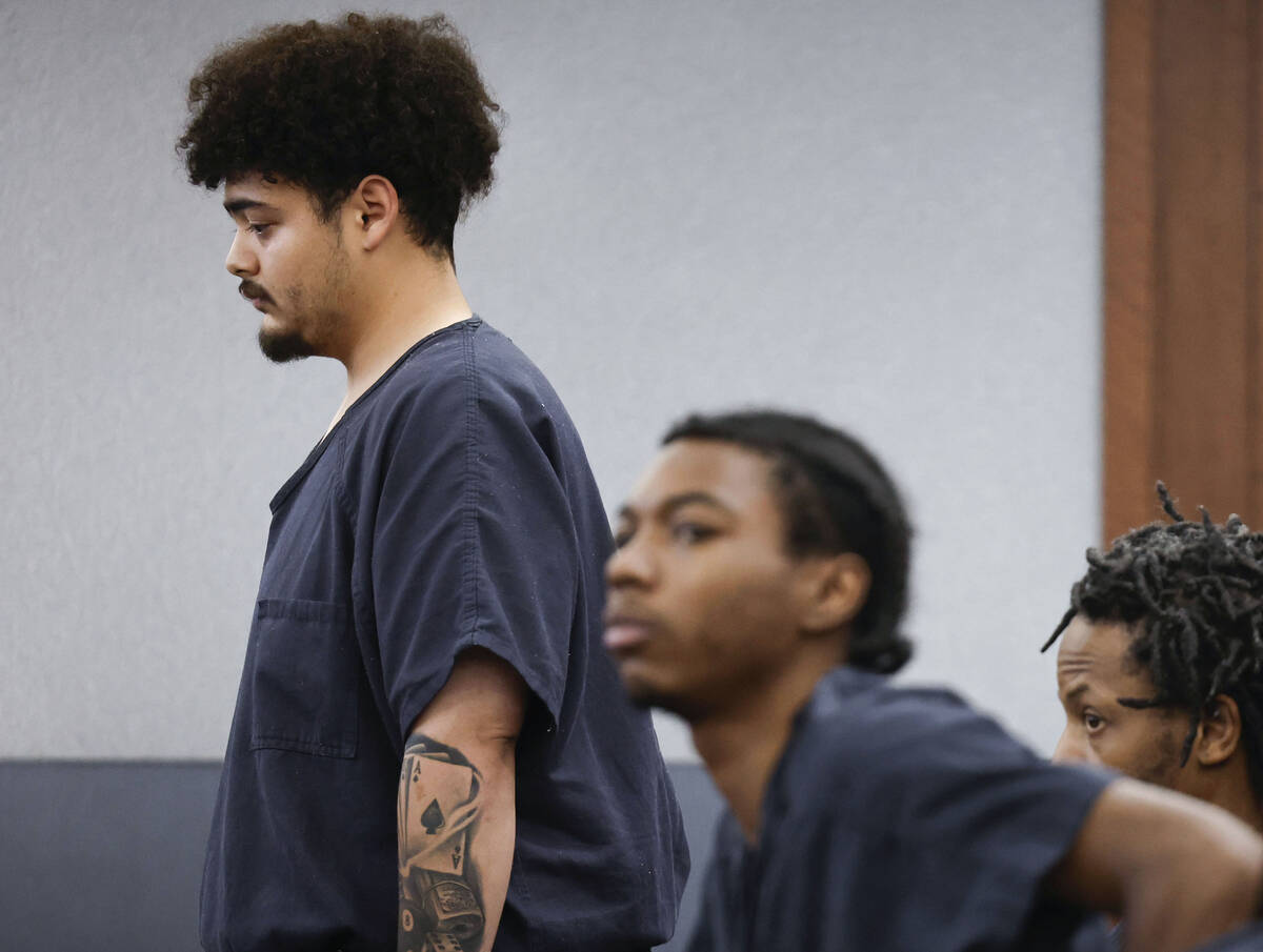Jaime Bustillos, left, accused of shooting at Las Vegas police, appears at his bail hearing Mon ...