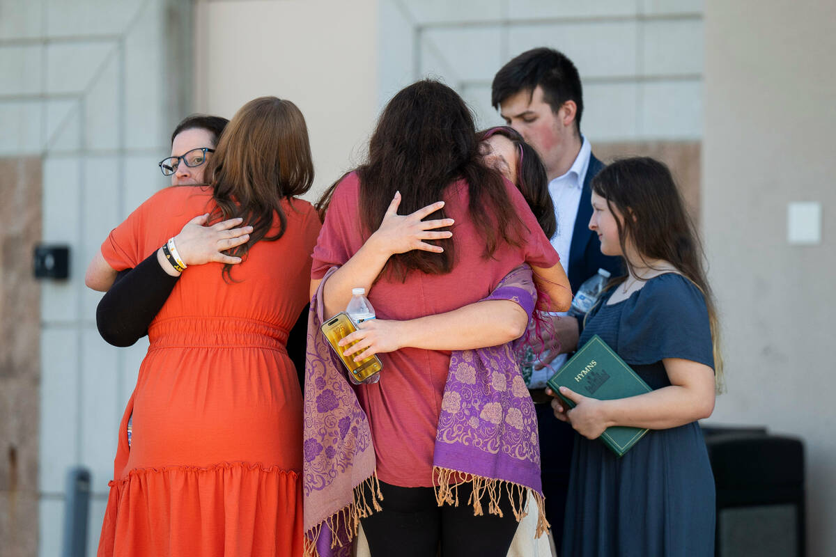 People are reunited at Trillium NCG Theatre with friends and family who were present during a n ...