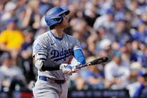 Los Angeles Dodgers' Shohei Ohtani watches his solo home run off Seattle Mariners pitcher ...