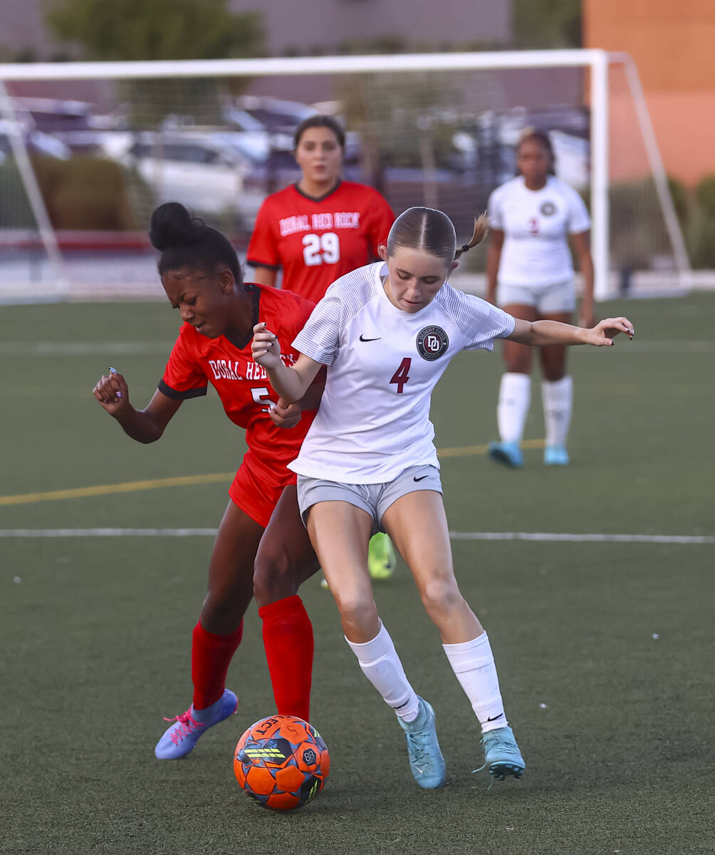 Doral Academy's Sanyi Thompson (5) and Desert Oasis' Ava Lyman (4) vie for the ball d ...