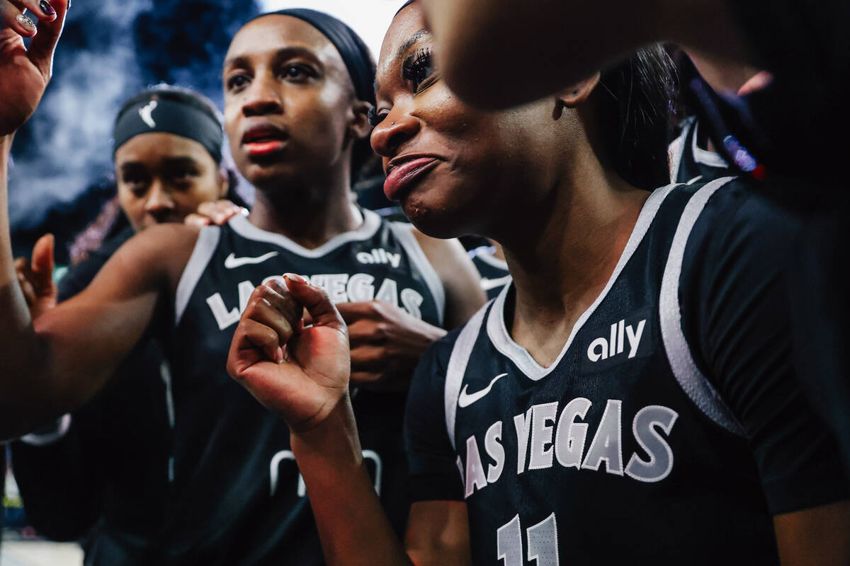 Aces guard Dana Evans (11) celebrates in the huddle after winning game five of a WNBA semifinal ...