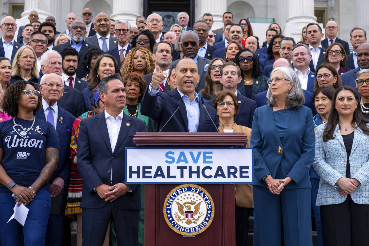 House Minority Leader Hakeem Jeffries, D-N.Y., center, flanked by Rep. Pete Aguilar, D-Calif., ...