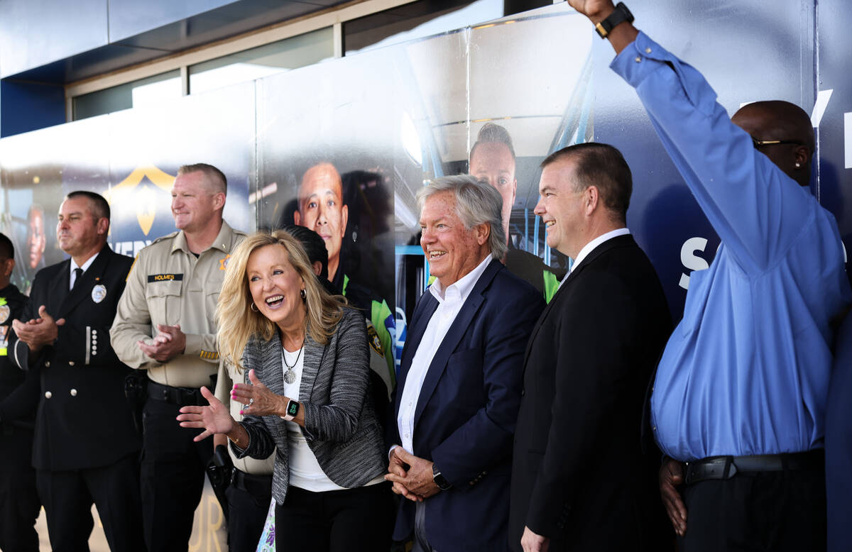 RTC Chief Executive Officer M.J. Maynard-Carey, middle, Clark County Commissioner Tick Segerblo ...