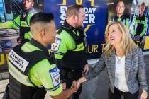 RTC Chief Executive Officer M.J. Maynard-Carey, right, talks with transit security officers at ...