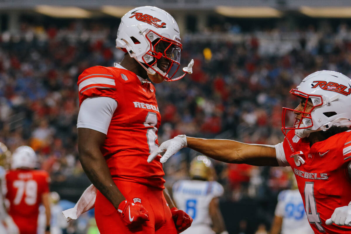 UNLV running back Keyvone Lee (2) celebrates running in a touchdown during the first half of th ...