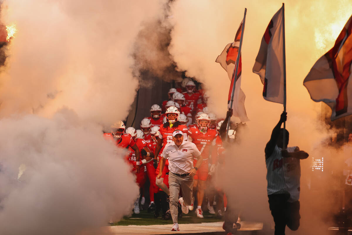 UNLV runs out before the football game on Saturday, Sept. 6, 2025 at Allegiant Stadium in Las V ...