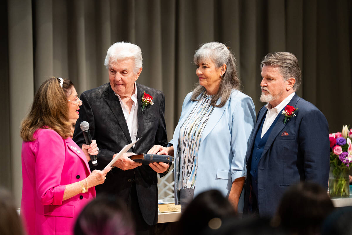 Newly appointed councilwoman Kara Kelley is sworn in during a special Las Vegas City Council me ...