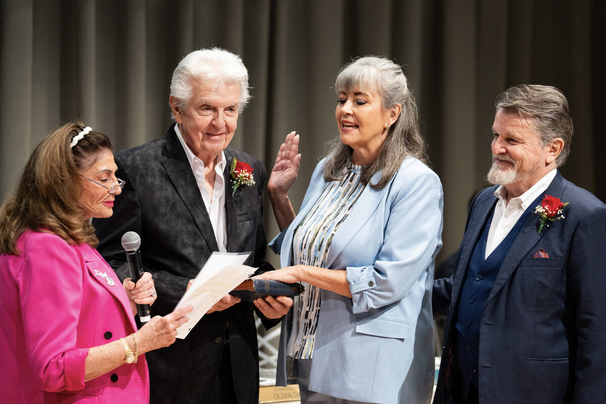 Newly appointed councilwoman Kara Kelley is sworn in during a special Las Vegas City Council me ...