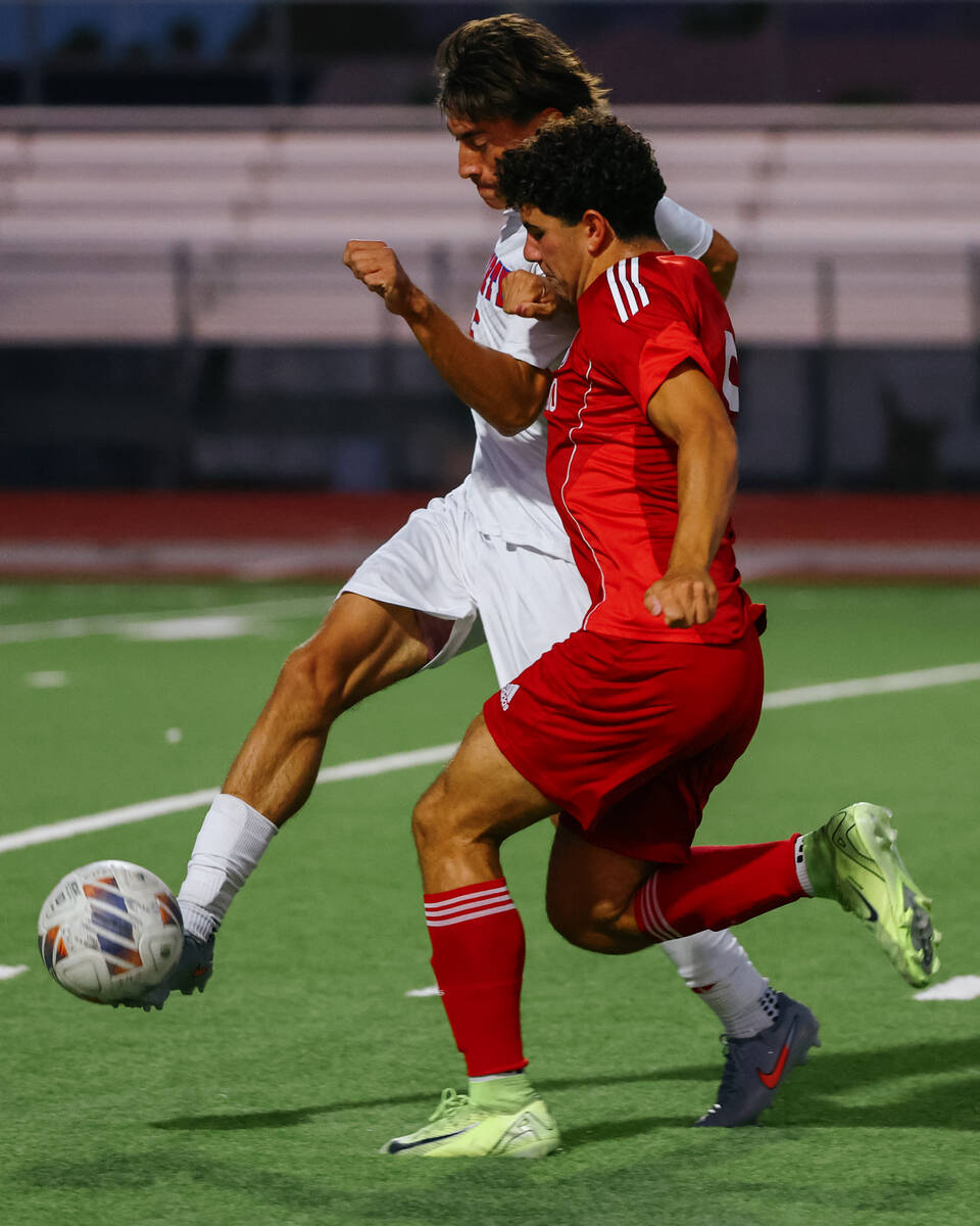 Liberty defender Diego Bermudez (5) kicks the ball out of reach of Coronado midfielder Dylan Fl ...
