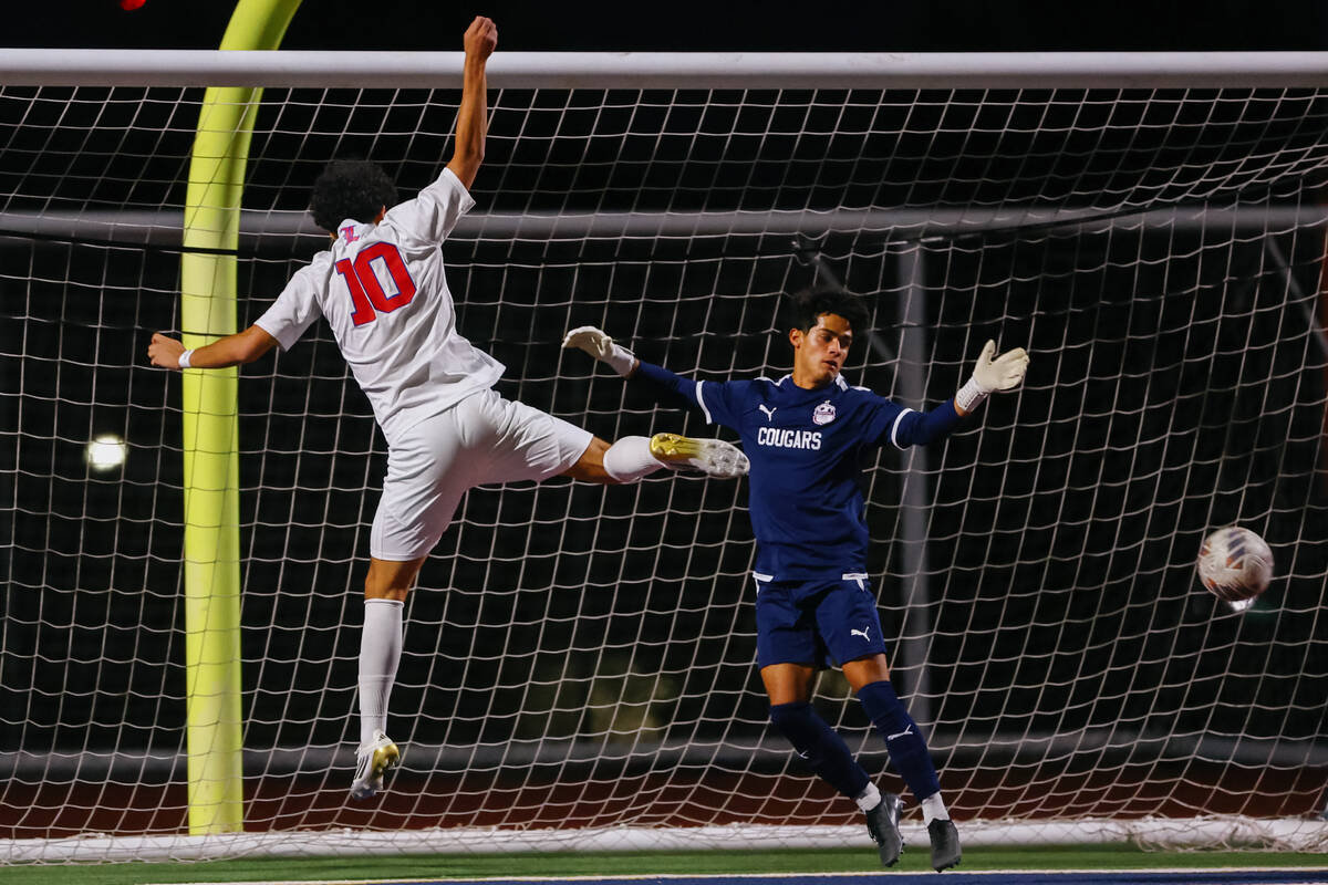 Liberty striker Justin Gilliland (10) just misses a shot on goal against Coronado goalkeeper Lo ...