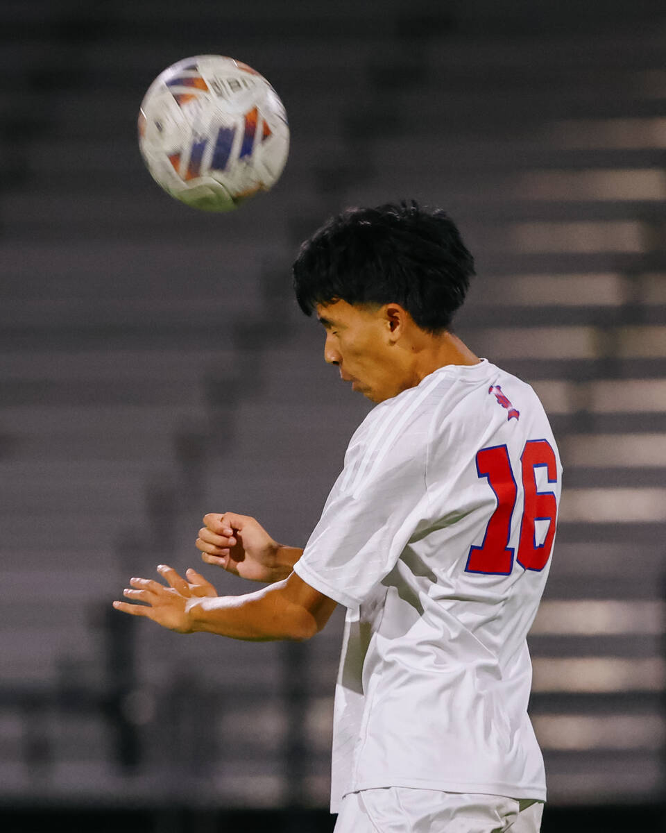 Liberty defender Nile Chua (16) heads the ball during the soccer game on Tuesday, Sept. 30, 202 ...