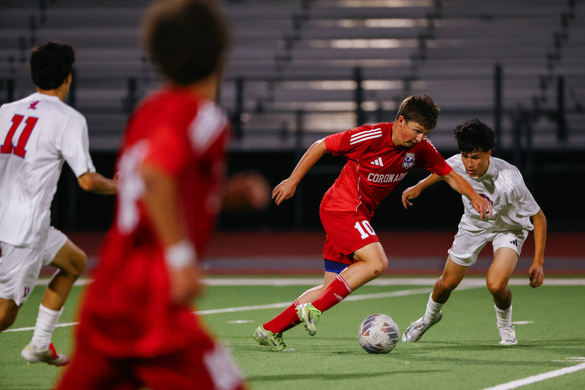 Coronado midfielder Aiden Sena (10) sprints with the ball against Liberty midfielder Rio DeSouz ...