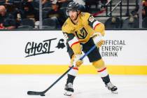 Golden Knights defenseman Dylan Coghlan (52) skates the puck during a preseason NHL hockey game ...