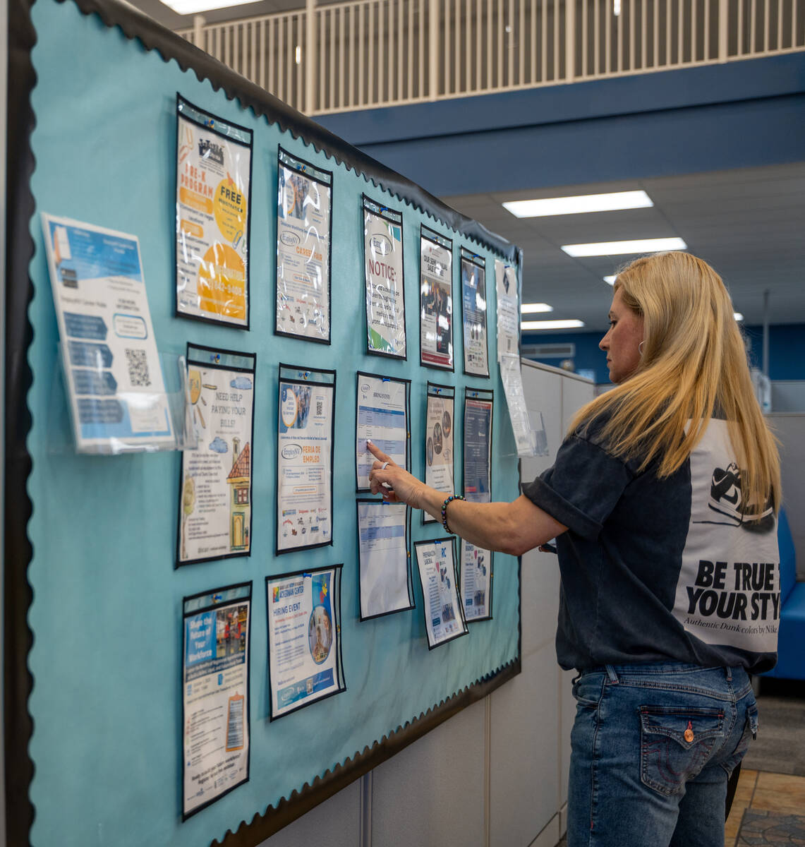 Jae Turney scans a job and resource board at EmployNV Career Hub in Las Vegas Sept. 29, 2025. T ...