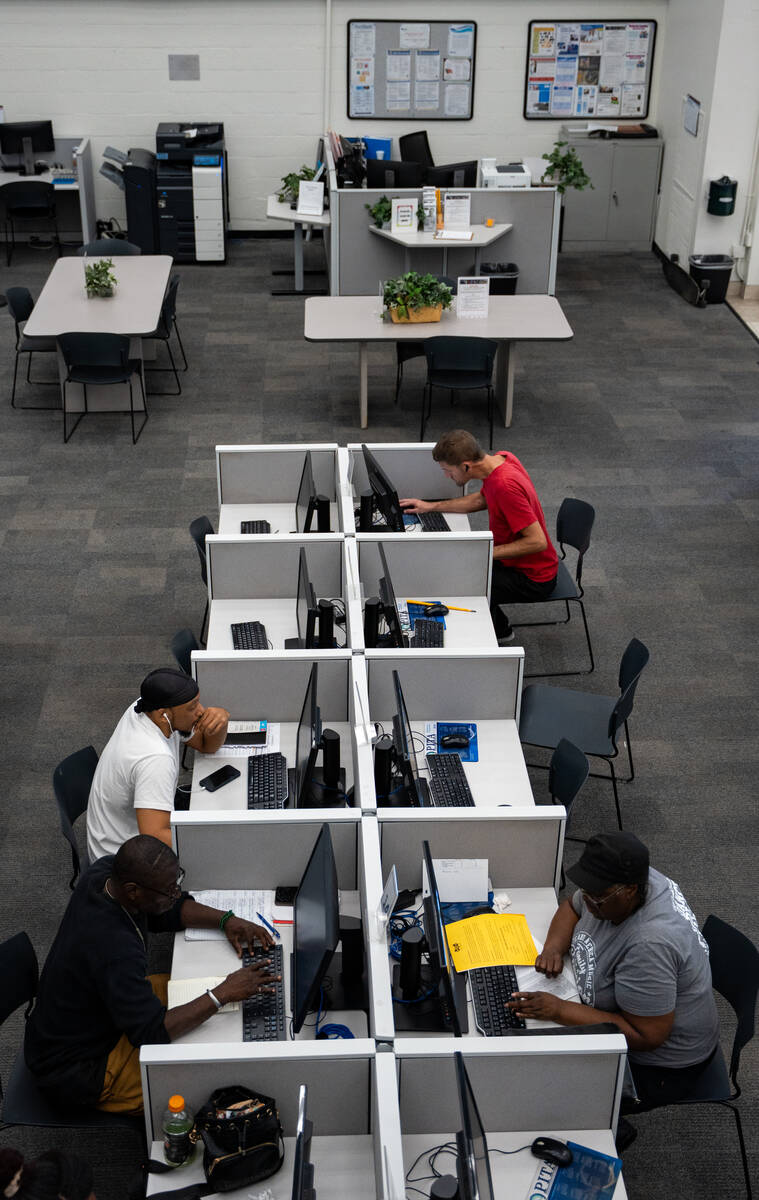 Job seekers use computers at EmployNV Career Hub in Las Vegas Sept. 29, 2025. The computers are ...