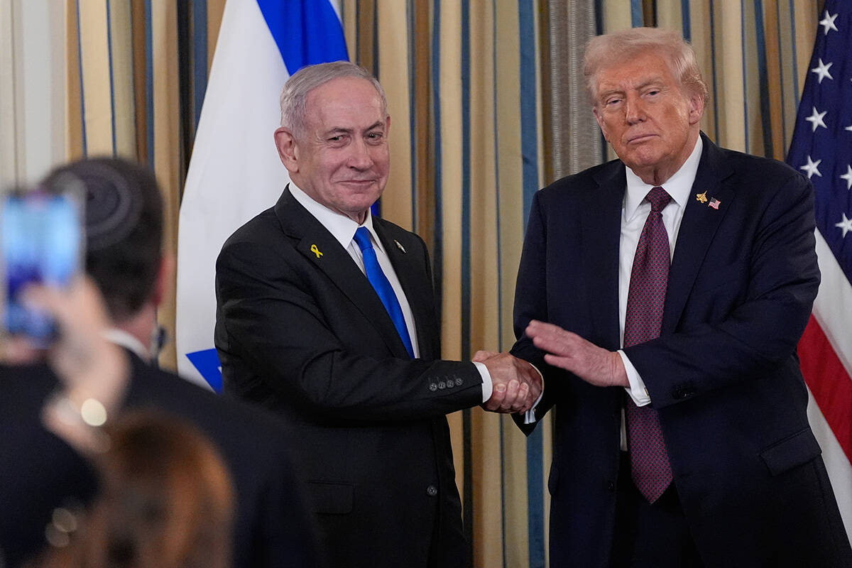 Israel's Prime Minister Benjamin Netanyahu shakes hands with President Donald Trump after ...
