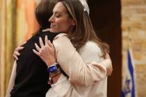 Rabbi-Cantor Jessica Hutchings hugs a congregant after giving the Yom Kippur sermon at Congrega ...