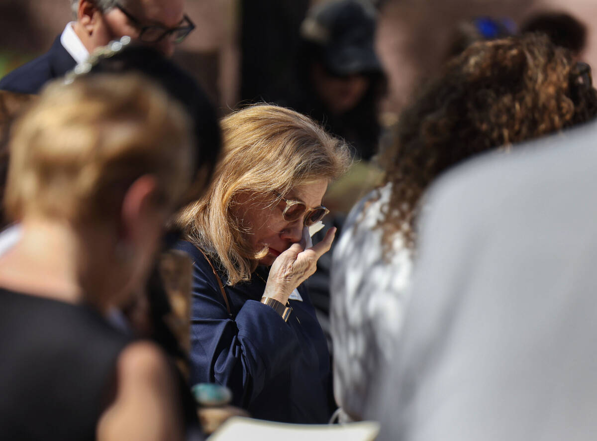 Congregants mourn the loss of loved ones during a Yahrzeit Engraving Dedication in the King Dav ...