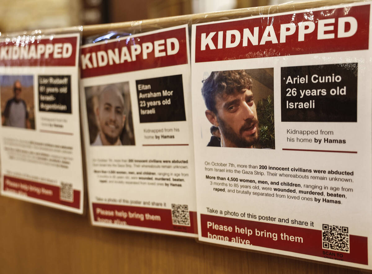 A memorial at Congregation Ner Tamid in Henderson displays images of hostages held by Hamas ter ...