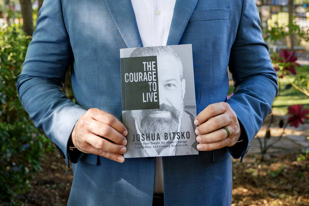 Former Metropolitan Police Department sergeant Josh Bitsko holds his newly authored book "The C ...