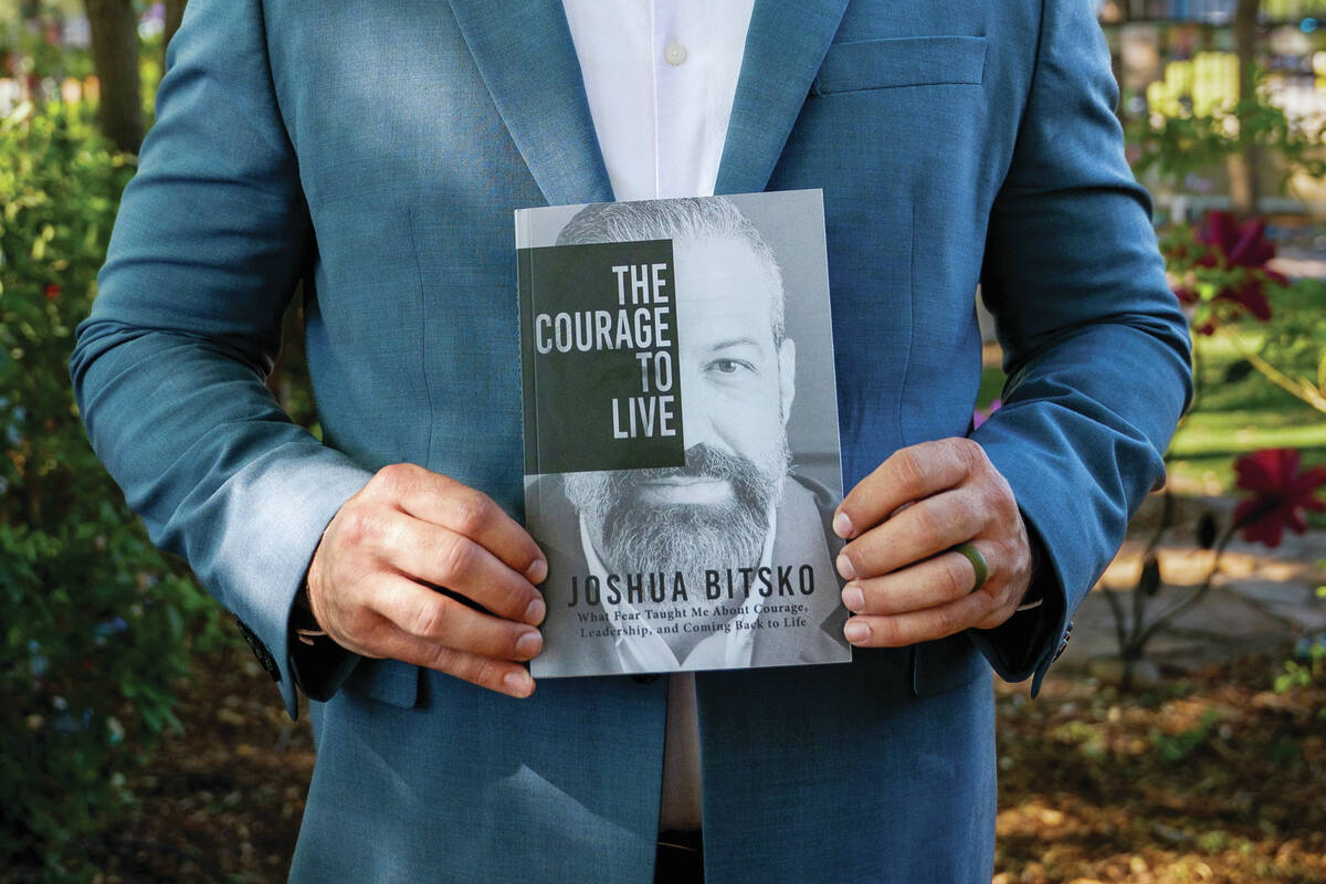 Former Metropolitan Police Department sergeant Josh Bitsko holds his newly authored book "The C ...