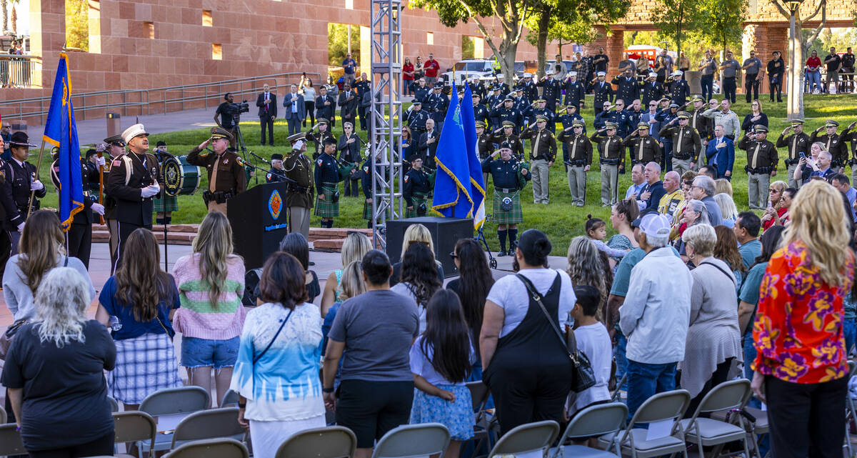 Clark County Fire Department Captain Erlantz Muguira performs the National Anthem during the 1 ...